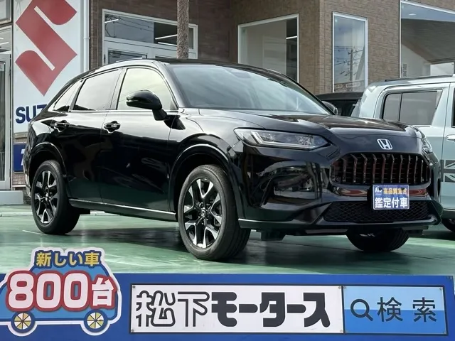 ZR-V(ホンダ)e：HEV Z BSI 後退出庫サポートレス登録済未使用車 0
