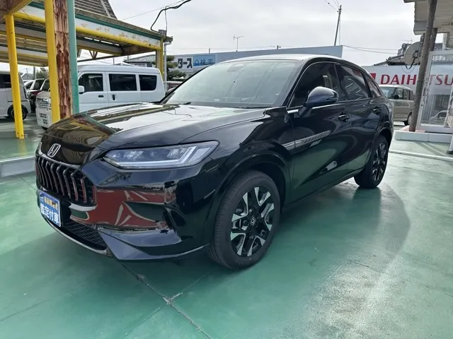 ZR-V(ホンダ)e：HEV Z BSI 後退出庫サポートレス登録済未使用車 1