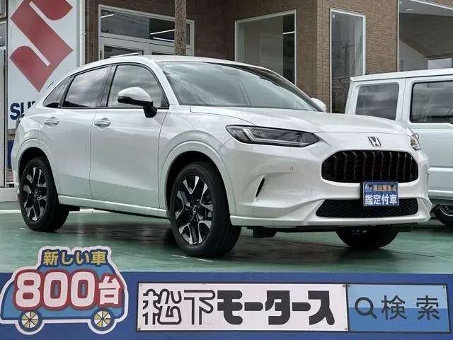 ZR-V(ホンダ)e：HEV Z BSI 後退出庫サポートレス登録済未使用車 0