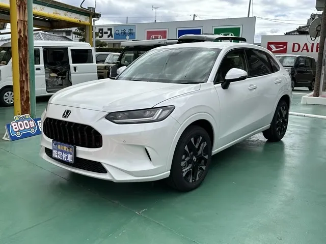 ZR-V(ホンダ)e：HEV Z BSI 後退出庫サポートレス登録済未使用車 1