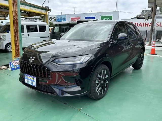 ZR-V(ホンダ)e：HEV Z BSI 後退出庫サポートレス登録済未使用車 1