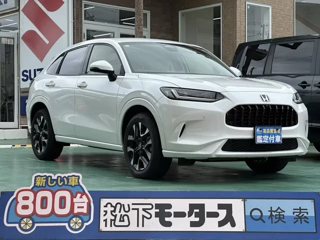 ZR-V(ホンダ)e：HEV Z BSI 後退出庫サポートレス登録済未使用車 0