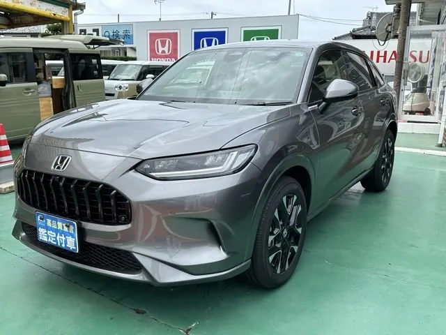 ZR-V(ホンダ)e：HEV Z BSI 後退出庫サポートレス登録済未使用車 1