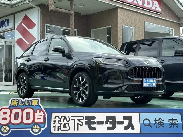 ZR-V(ホンダ)e：HEV Z BSI 後退出庫サポートレス登録済未使用車 0