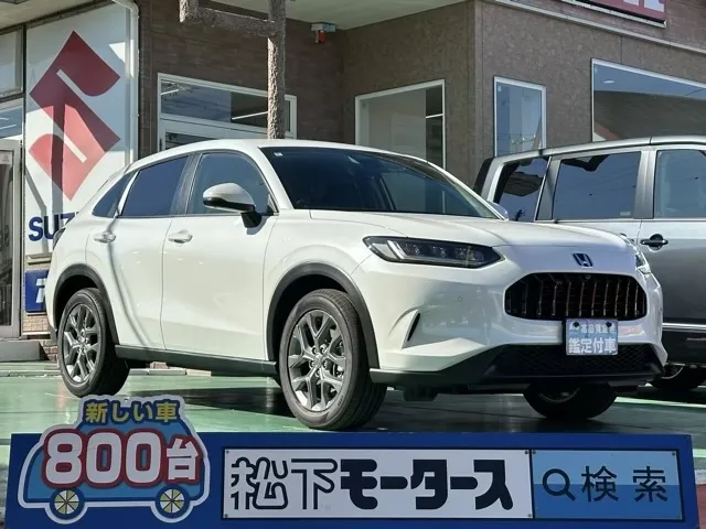 ZR-V(ホンダ)e：HEV X BSI 後退出庫サポートレス登録済未使用車 0